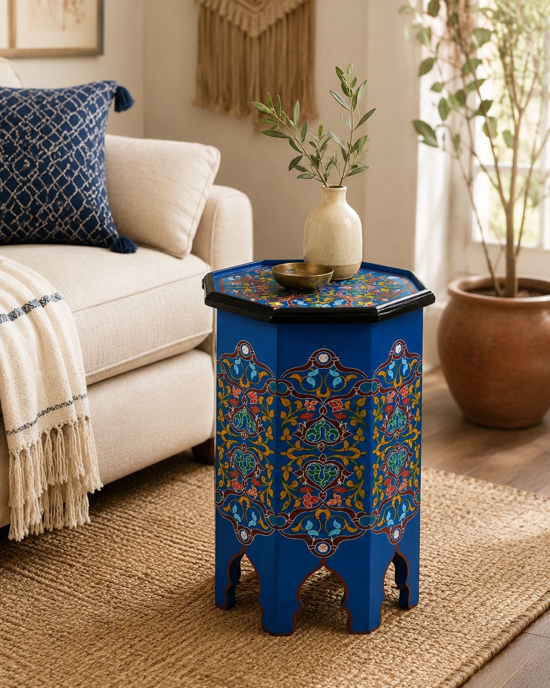 Handmade blue Moroccan table with colorful floral patterns 